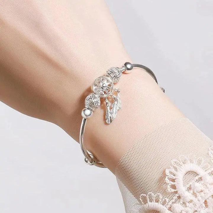 Pulsera de brazalete de atrapasueños color plata