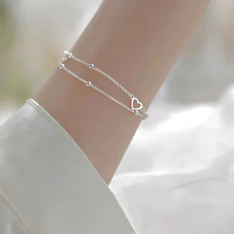 Pulsera de color plata con corazón y ajuste personalizable
