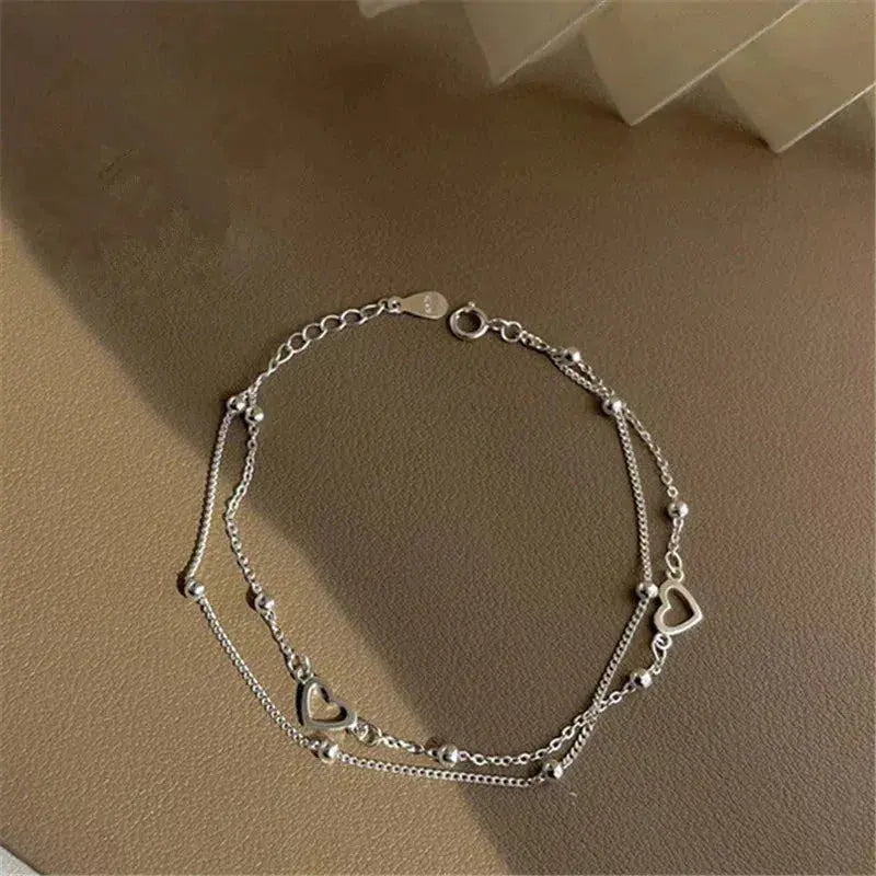 Pulsera de color plata con corazón y ajuste personalizable