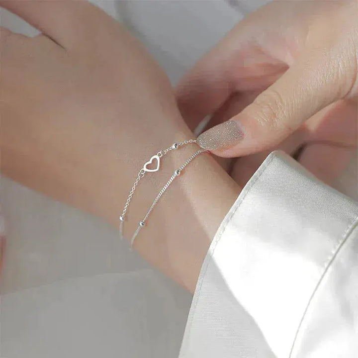 Pulsera de color plata con corazón y ajuste personalizable