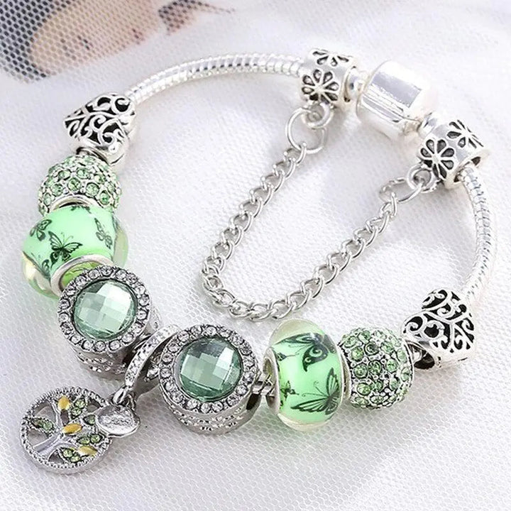 Brazalete elegante en color plata con cristal verde