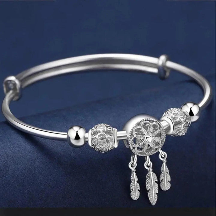 Pulsera de brazalete de atrapasueños color plata