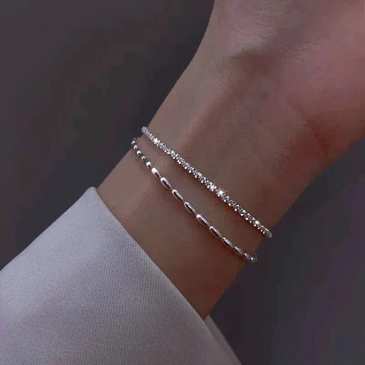 Elegantes set de pulsera de color plata con piedras de circonio