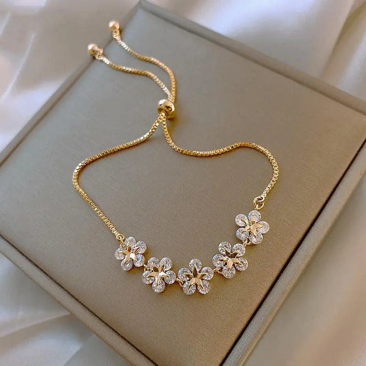Pulsera de margaritas de cristal en color oro