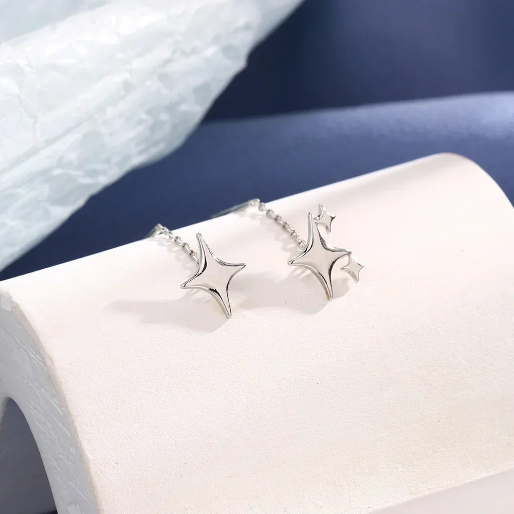 Pendientes de cadena en forma de estrella de color plata de ley