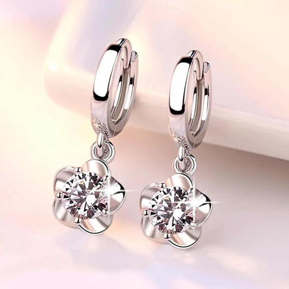 Pendientes de color plata esterlina con circonitas moradas y blancas