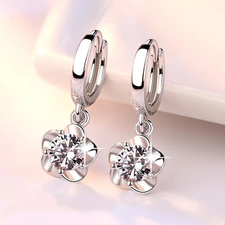 Pendientes de color plata esterlina con circonitas moradas y blancas