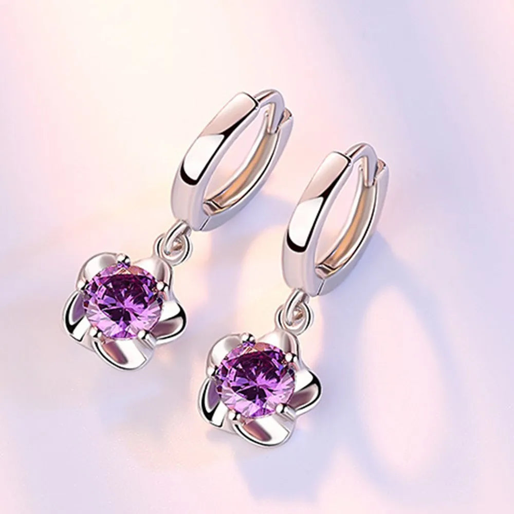 Pendientes de color plata esterlina con circonitas moradas y blancas