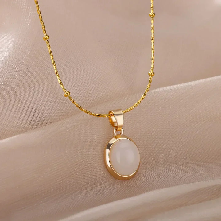 Elegante collar de acero inoxidable color oro con colgante de ópalo en forma de gota de agua