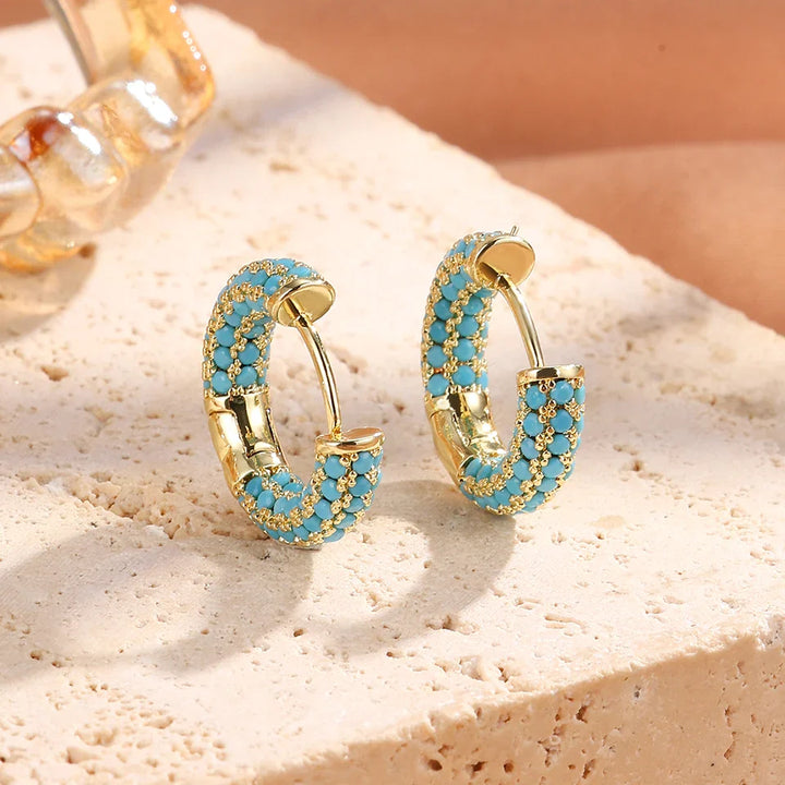 Pendientes de aro con flores en azul turquesa