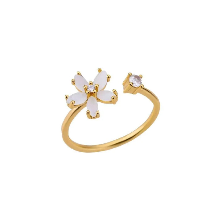 Anillo de flor de cinco pétalos en color oro con zirconia romántica