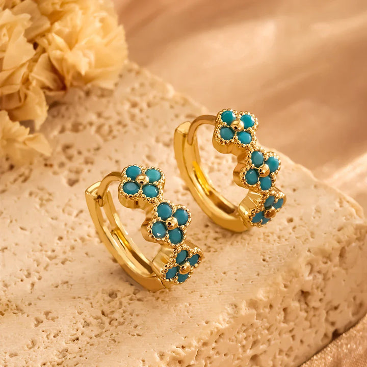 Pendientes de aro con flores en azul turquesa