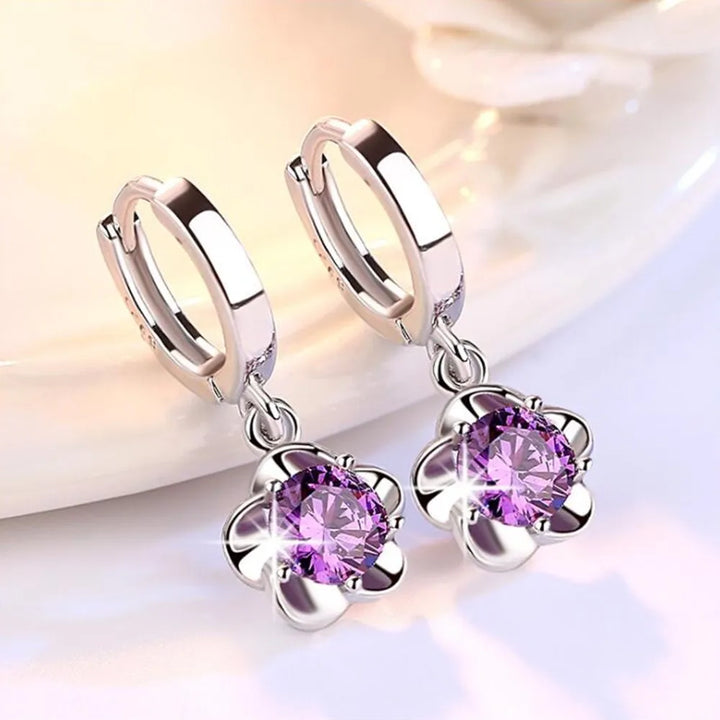 Pendientes de color plata esterlina con circonitas moradas y blancas