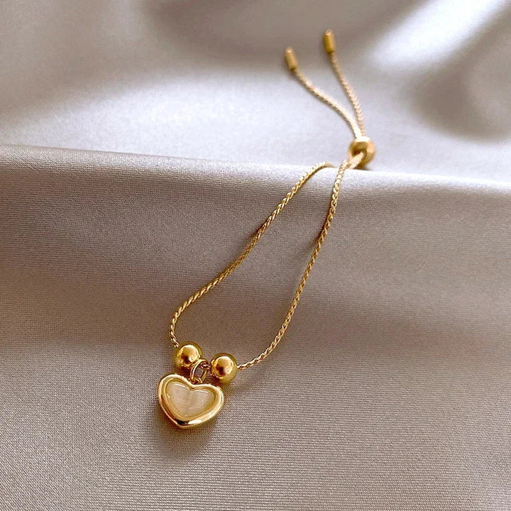 Pulsera de corazón de ópalo durazno color oro