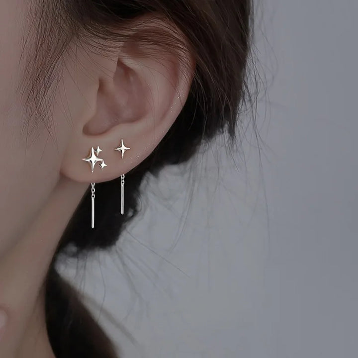 Pendientes de cadena en forma de estrella de color plata de ley