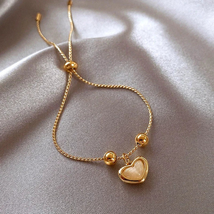 Pulsera de corazón de ópalo durazno color oro