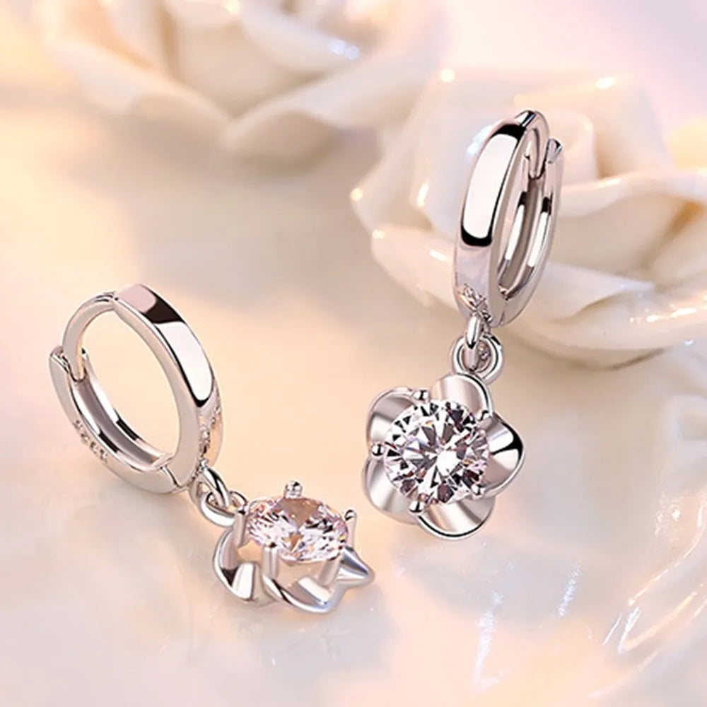 Pendientes de color plata esterlina con circonitas moradas y blancas