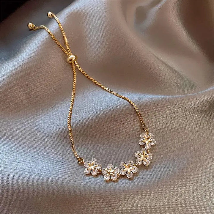 Pulsera de margaritas de cristal en color oro