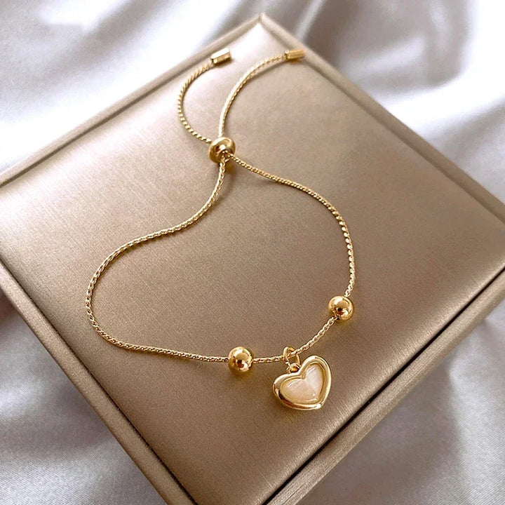 Pulsera de corazón de ópalo durazno color oro