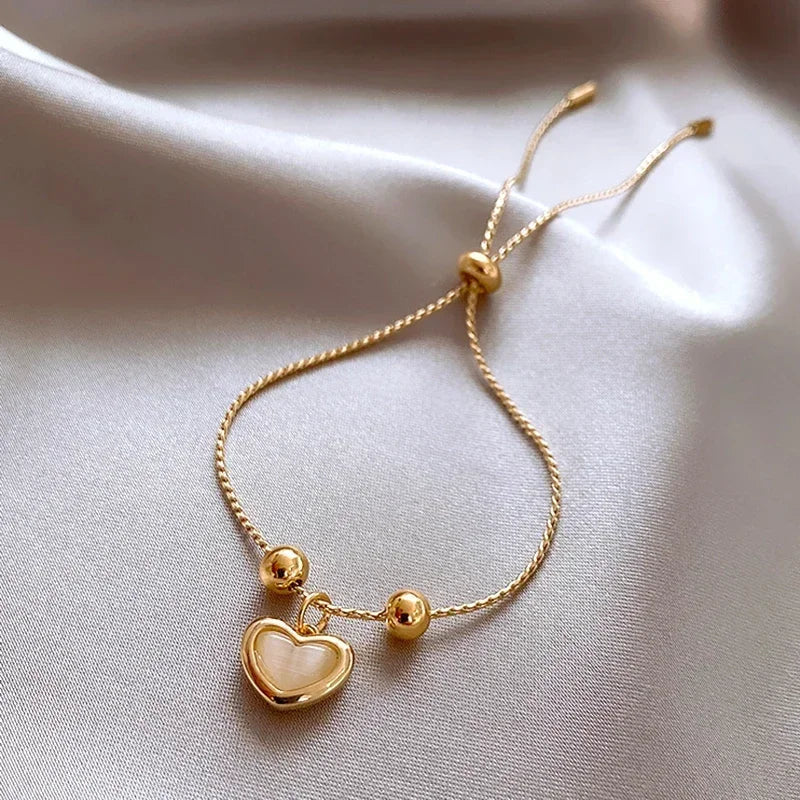 Pulsera de corazón de ópalo durazno color oro