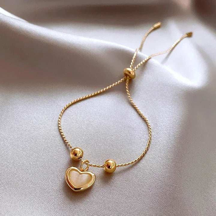 Pulsera de corazón de ópalo durazno color oro