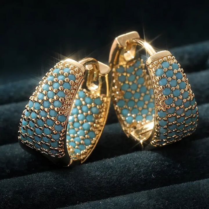 Pendientes de aro con cuentas de turquesa en tono color oro elegante