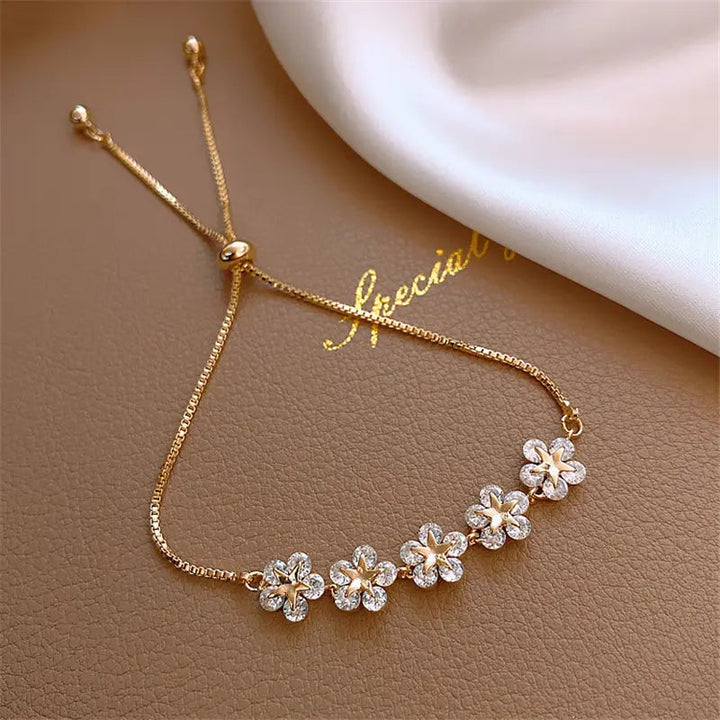 Pulsera de margaritas de cristal en color oro