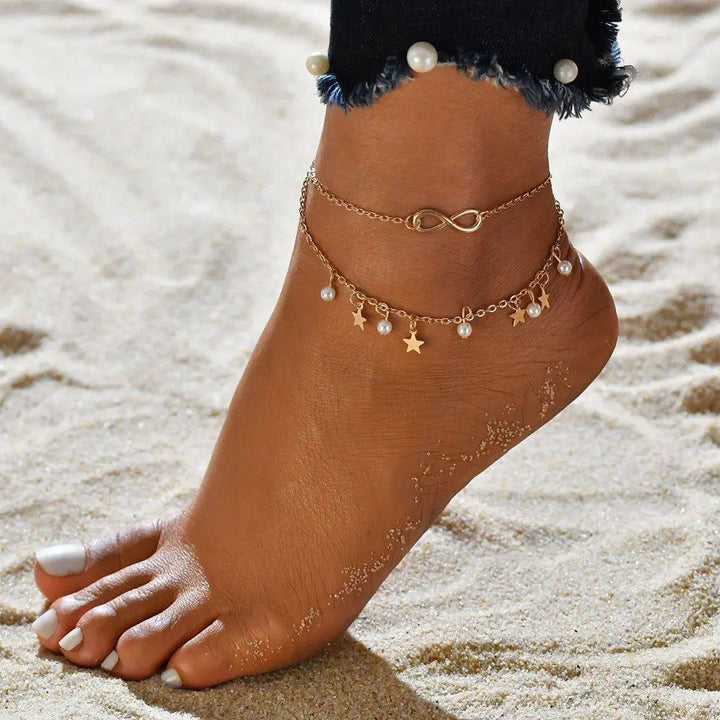 Elegante pulsera de tobillo de infinito y colgantes de estrella