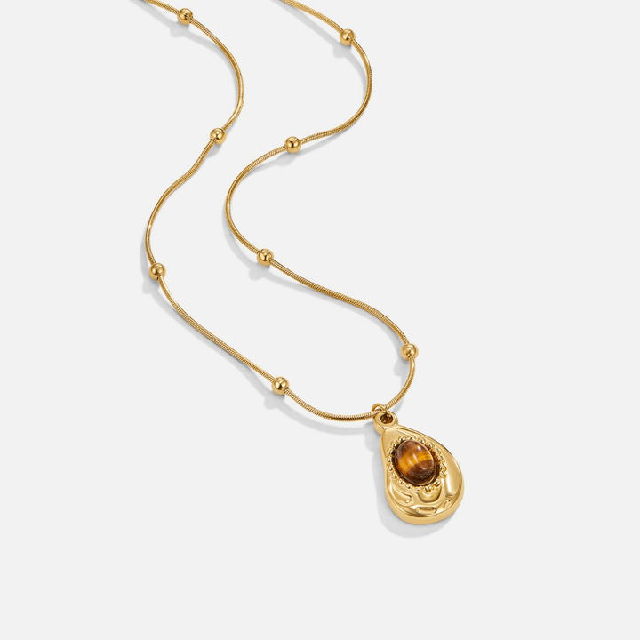 Elegante collar de color oro con piedra ojo de tigre